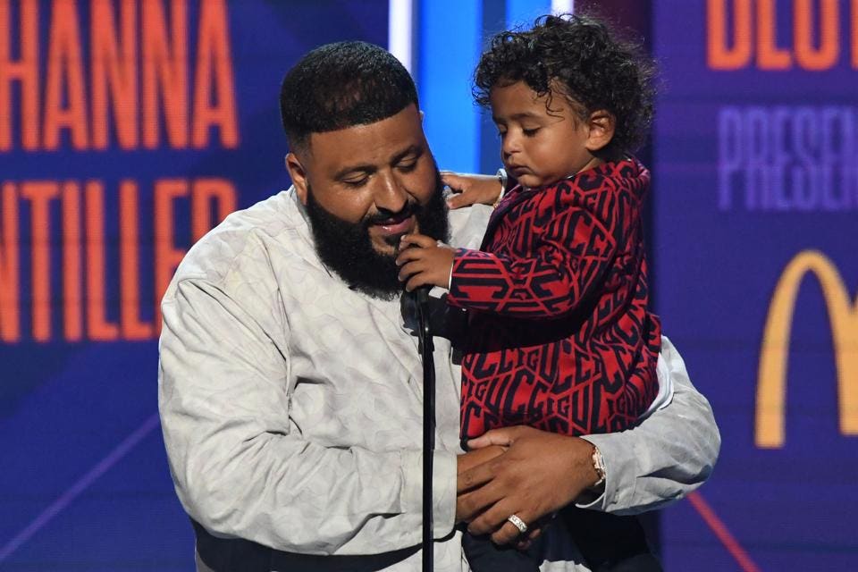 DJ Khaled holds his son Asahd Tuck Khaled as he accepts the Best Collaboration award for 'Wild... [+] Thoughts' during the BET Awards. (Valerie Macon/AFP/Getty Images)