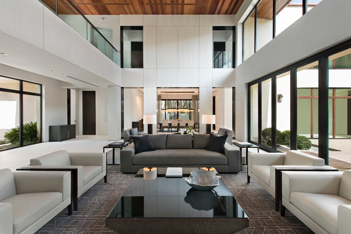 The residence boasts contemporary furnishings by Holly Hunt & Christian Liagre.
