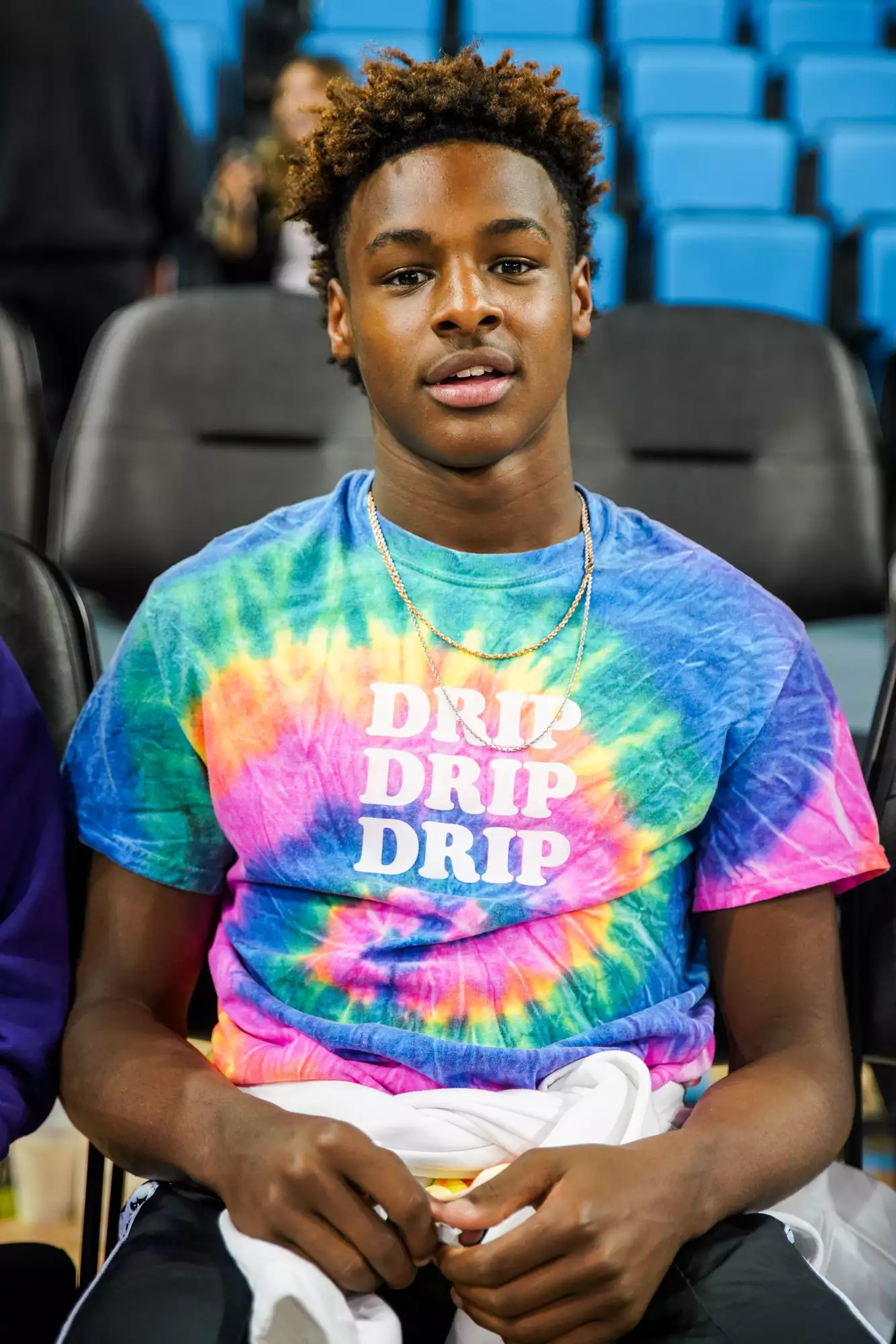 LeBron James Jr. sits court side after a game against the UCLA Bruins and the Presbyterian Blue Hose at Pauley Pavilion on November 19, 2018 in Los Angeles, California